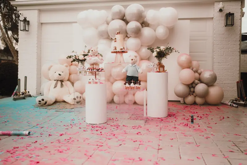 Gender Reveal: A blush, white and silver garland with teddy bears, styled for a driveway reveal.